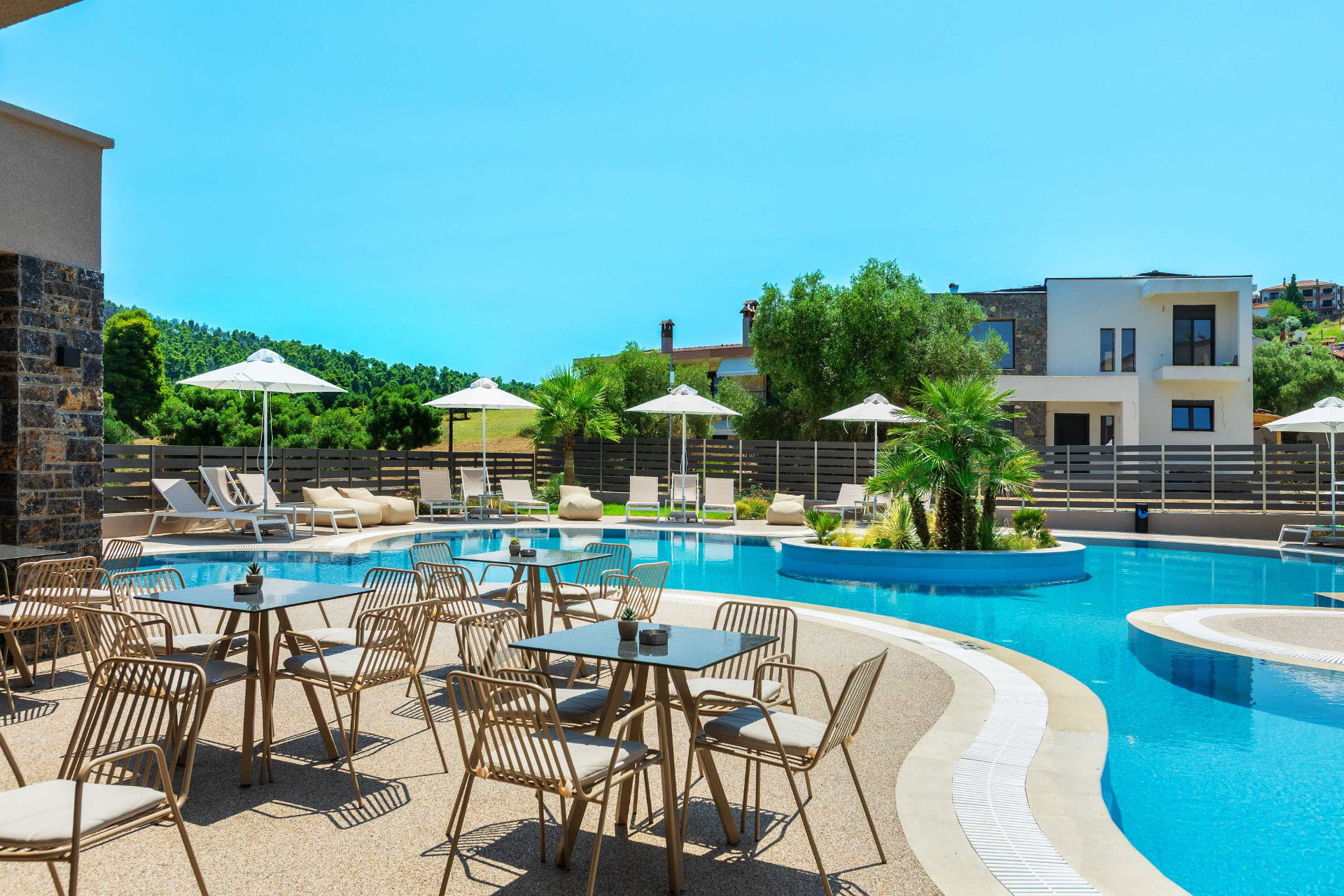 anese — pool bar seating by the water