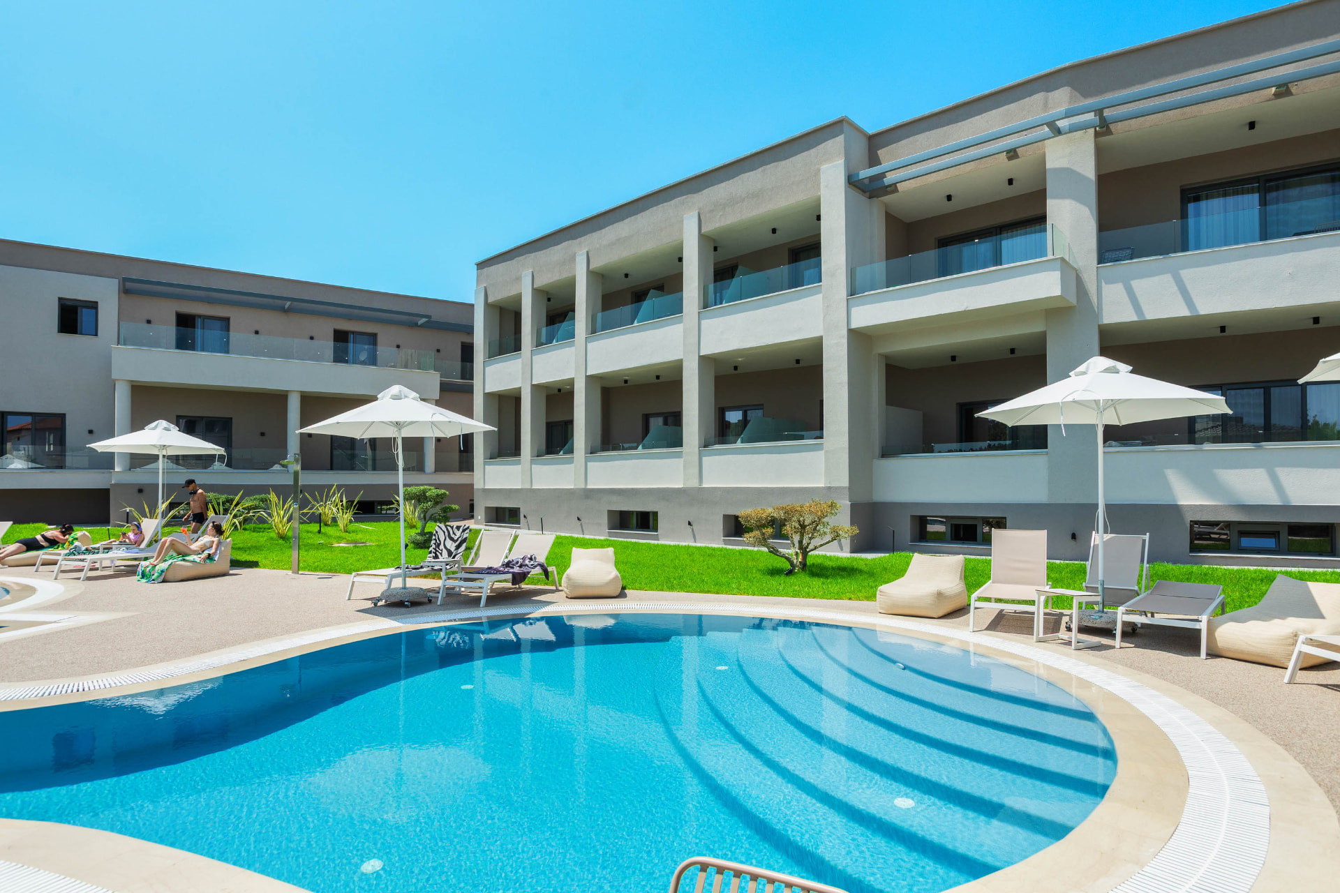 anese — pool and apartments in daylight